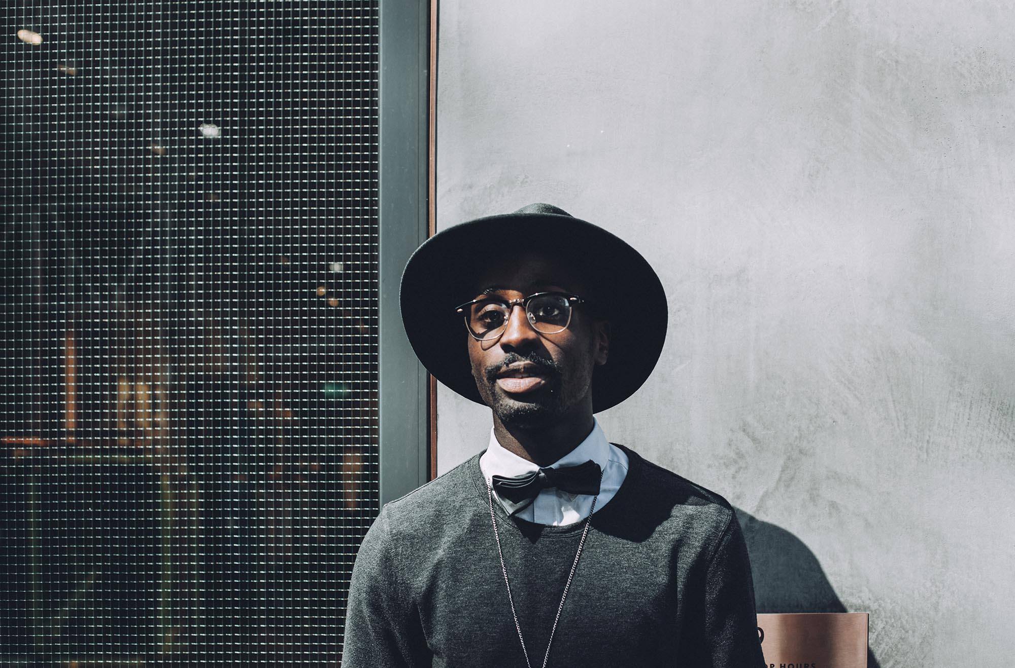 man wearing Valencia's spring collection hat, sweater, and bowtie